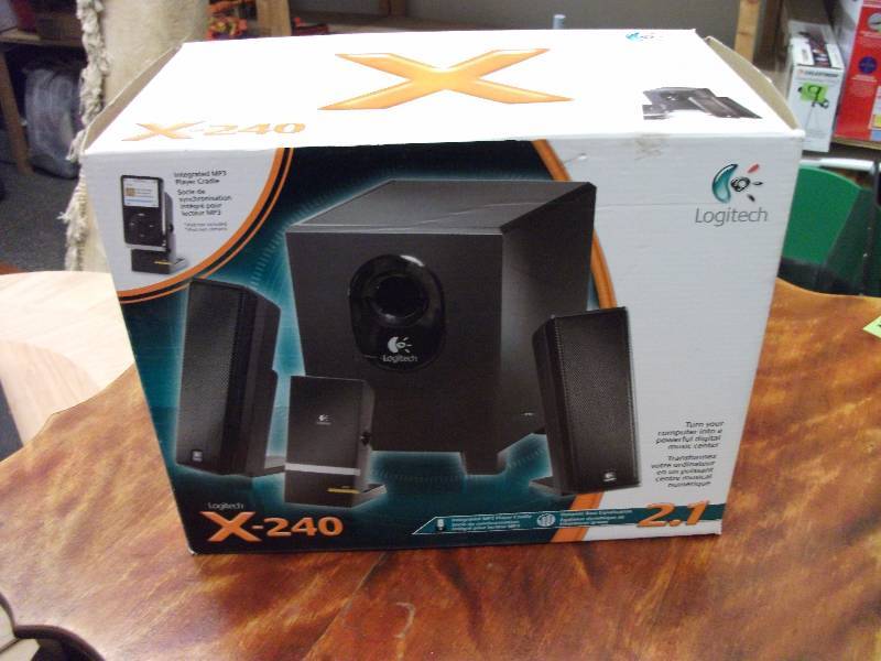 lot 23 image: X-240 Logitech MP3 (Not Included) Player (Turns Your Computer Into A Digital Music Center)