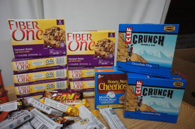 lot 175 image: Large Lot of Assorted Granola Bars, Protein Bars, Fiber Bars, Cereal Bars and More - All Items Expired In 2016 -