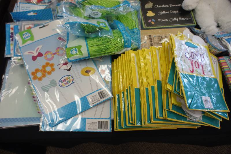 lot 147 image: Large Lot of Easter Decorations- Lot consists of Easter Bags, Wall-Art, Stuffed Bears, Window Decorations, Easter Grass, Placemats, Coloring Books and Banners