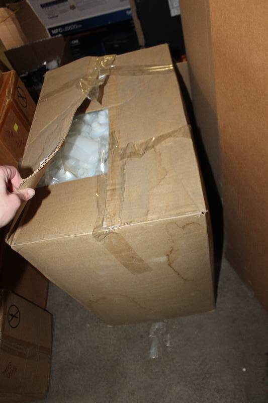 Boxes of Small Plastic Lotion Bottles