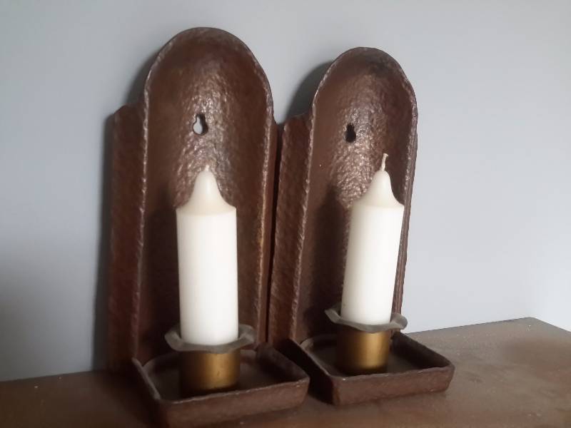 lot 36 image: wood shelf and heavy metal candle sconses