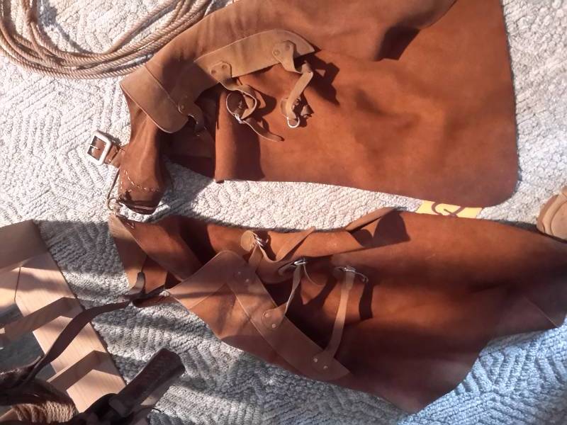 lot 72 image: Pair of Leather Chaps, Stirrup, Lasoo type rope