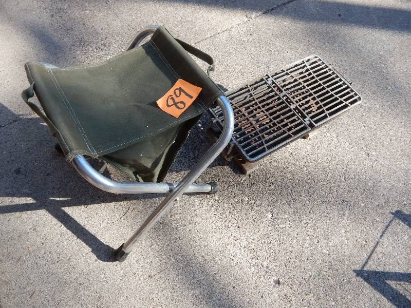 lot 89 image: Heavy Steel GrillStove.. Folding Camp stool with storage compartment