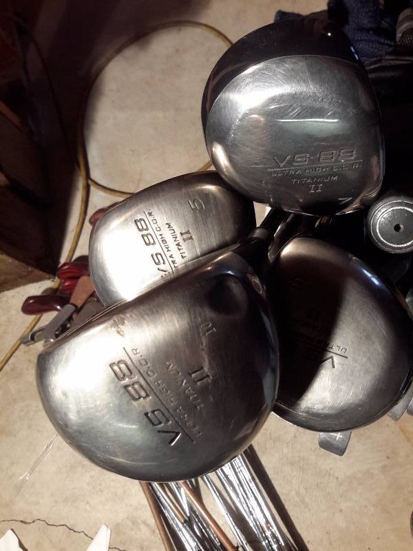 lot 138 image: Set of Ping ironsputter with metal shaft  Set of V588 Titanium Woods.. 1,3, 5, 7  Bag and Umbrella