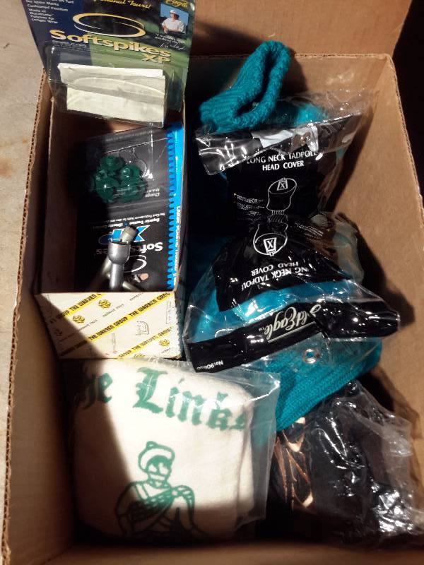 lot 141 image: Misc. Golf items.. Balls, towels and other as pictured.. Mainly Balls