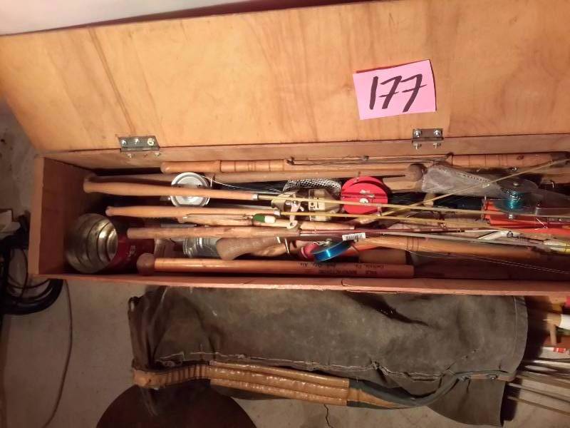 lot 177 image: Misc Ice Fishing poles, tip ups and other fishing items.. Includes box