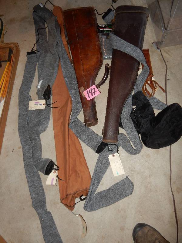 lot 198 image: Lot of Gun Socks and 2 Leather Gun cases.