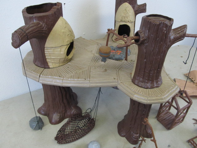lot 82 image: Vintage Star Wars EWOK Village & Dagobah Playsets