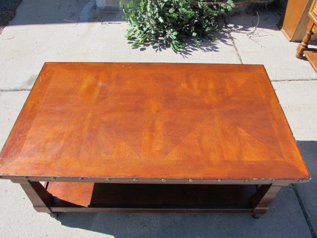 lot 37 image: Studded Wood Lift -Top Coffee Table on Casters