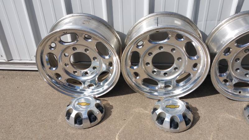 lot 7 image: Set of Four 8 Lug 16 Wheels and Chevy Caps
