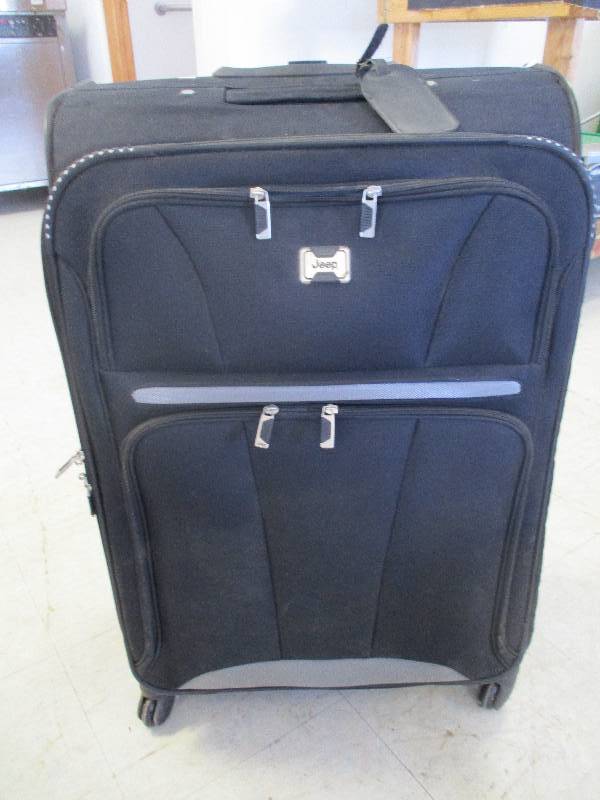 lot 56 image: Large Nylon Jeep Suitcase