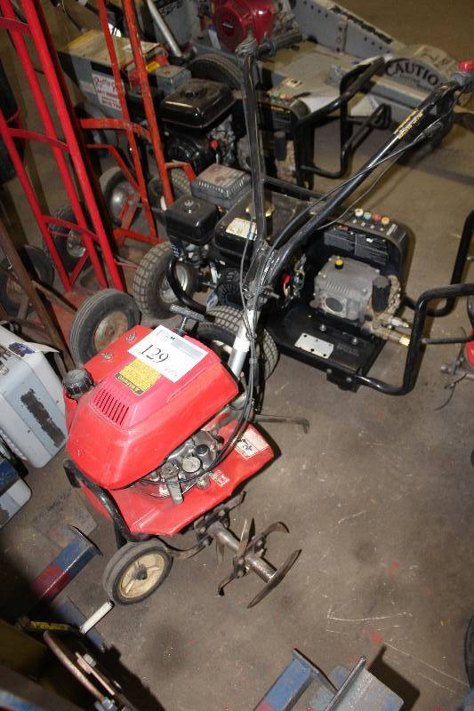 lot 129 image: Honda Gas Powered Rear Tine Tiller