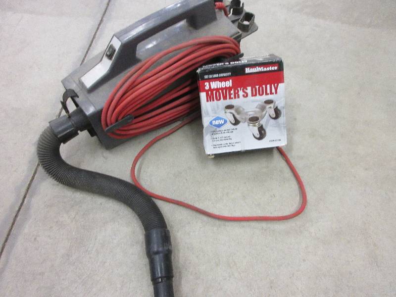 lot 134 image: VACUUM AND LIKE NEW 3 WHEEL MOVING DOLLY