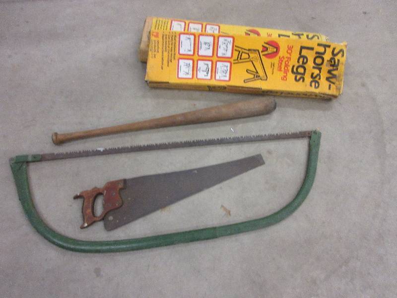 lot 156 image: MISC LOT TREE SAW,  HAND SAW, SAW HORSE LEGS, LOUISVILLE BAT, (H & B)
