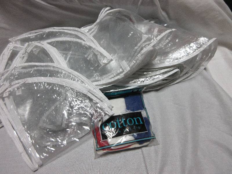 lot 178 image: LARGE LOT OF CLOTHES COVERS, HAT, MILLER BAG, NEW GIRLS SOCKS