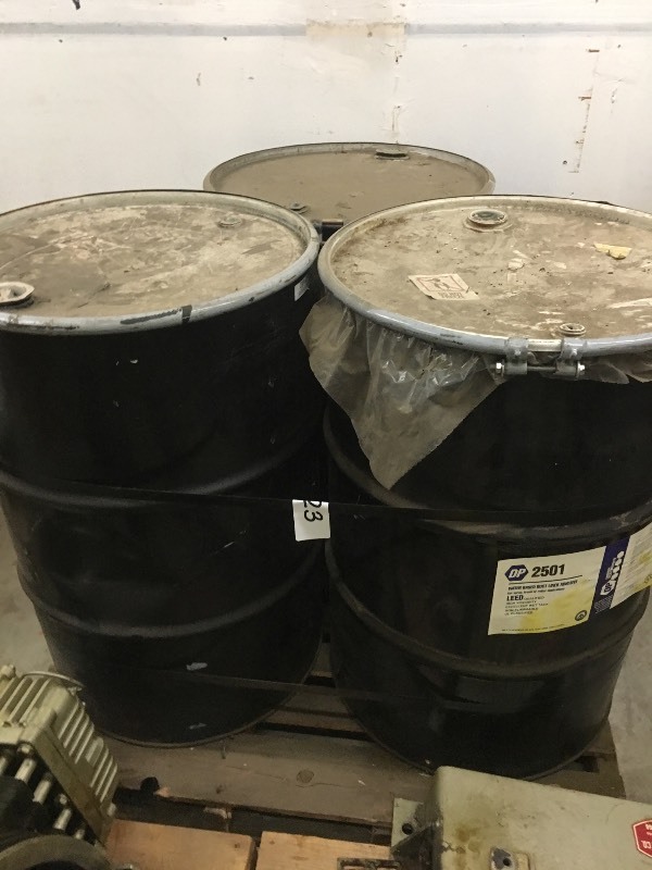 3 drums of adhesive