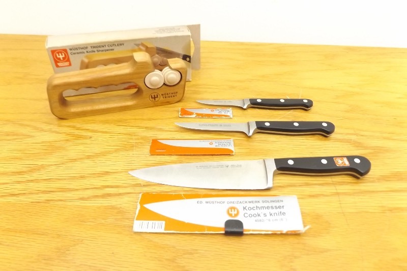 lot 14 image: Set of 3 Wusthof Trident Knives, and Knife Sharpener