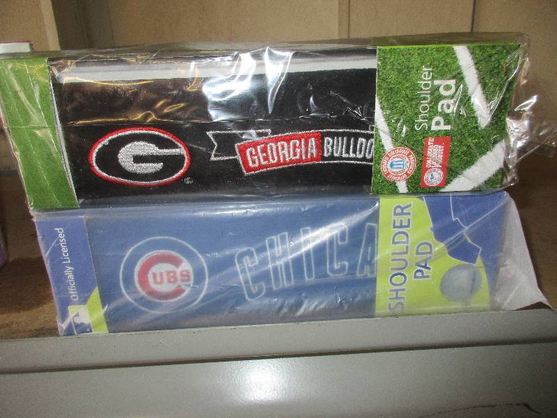 8 shoulder pads - 4 Chicago cubs and 4 Georgia bull dogs