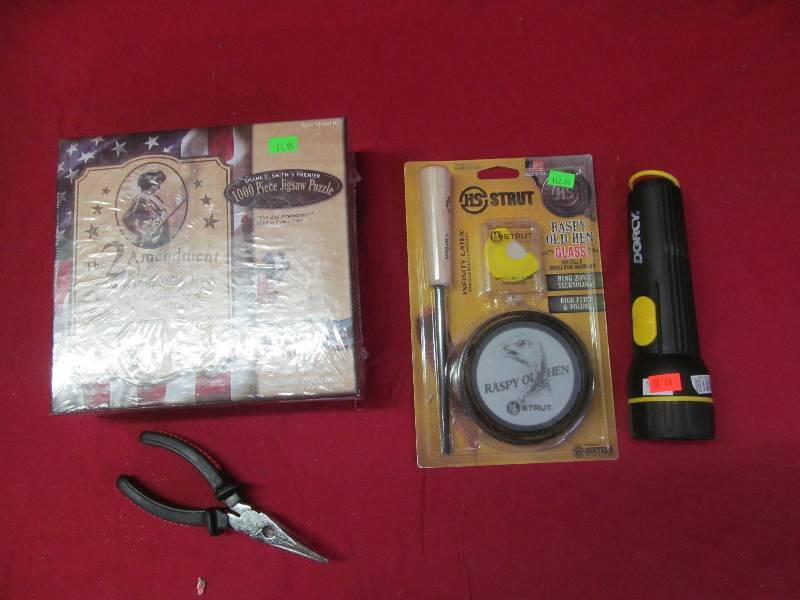 lot 118 image: puzzle, flashlight, turkey call