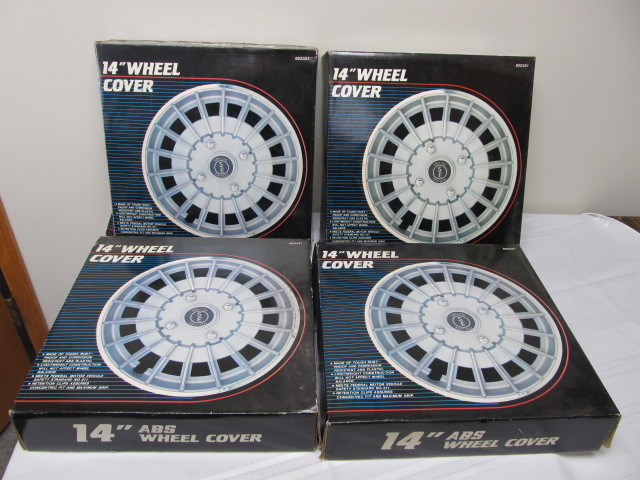 lot 23 image: Set of 4 NOS Wheel Covers - 14