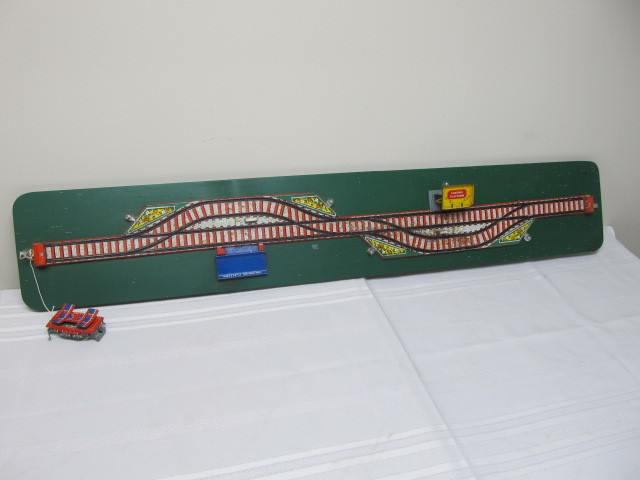 lot 40 image: Vintage Tin Litho Train Car Display on Board