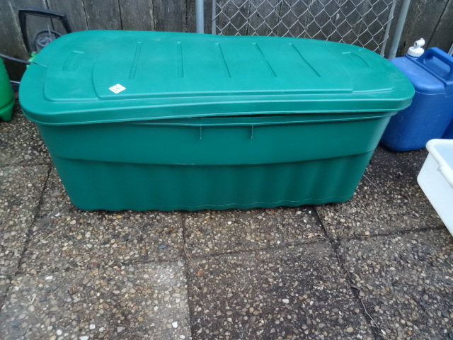 Large rubbermaid tote full of new artificial flowers