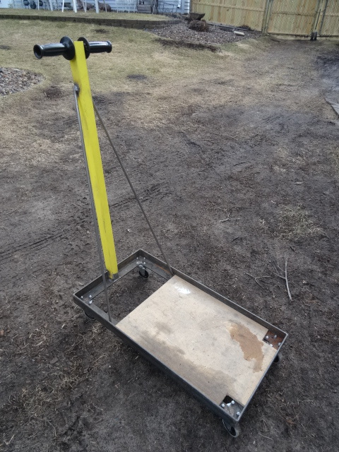 Metal framed cart with long handle. 17 x 32