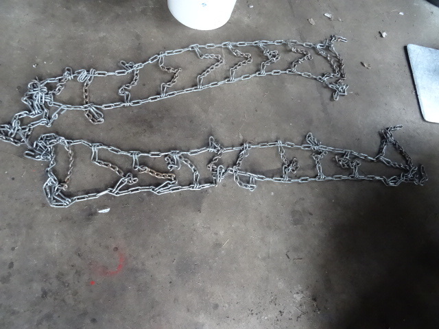 Pair of lawn mower  Atv tire chains. Misc chain pieces