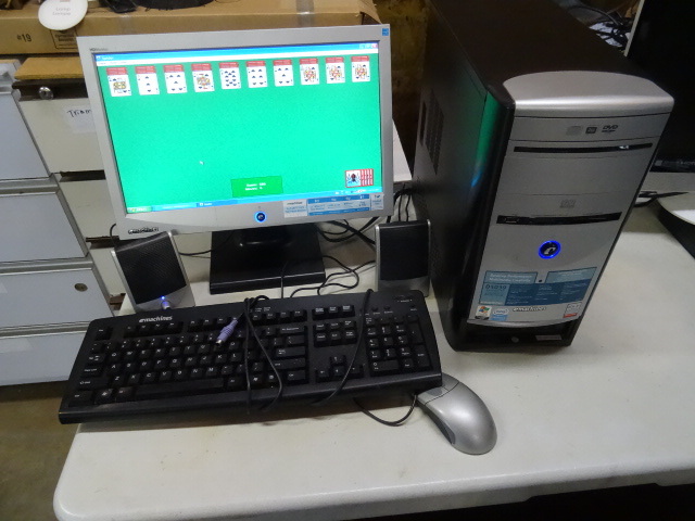 E machines computer. Windows XP. 17 monitor. Keyboard, mouse, and speakers included. Works