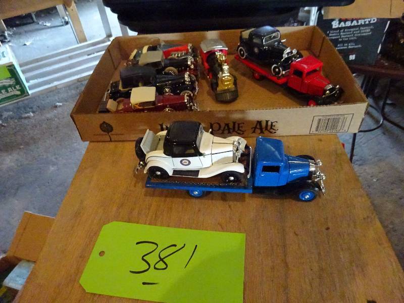 lot 381 image: Chryslers, Ford trucks