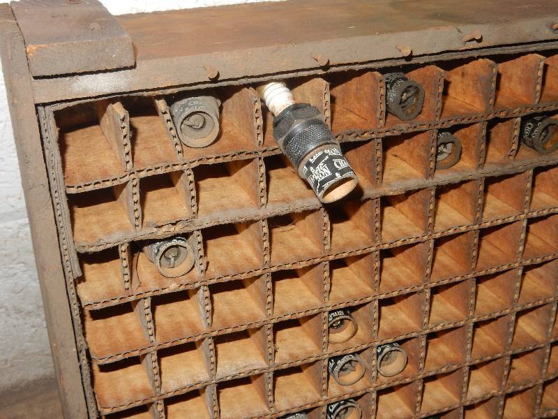 lot 70 image: Vintage Spark Plug display with SOME sparkplugs included.