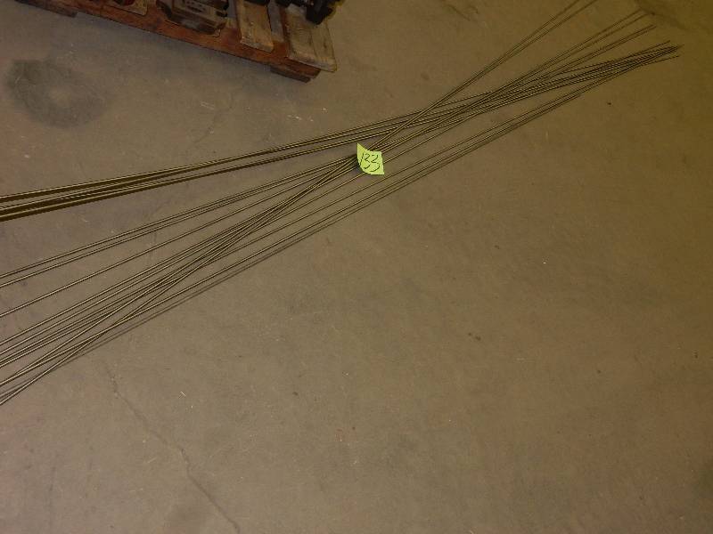 lot 133 image: 15, 304 Stainless 14 in Diameter round metal rods.. 12 Ft lengths
