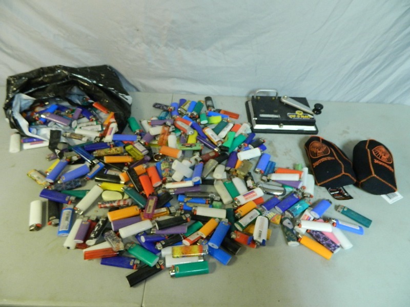 lot 18 image: Lighters, Cigarette Machine, and Koozies