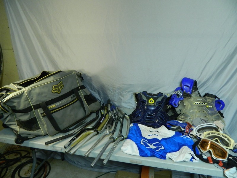 lot 27 image: Fox Racing Bag on Wheels Full of Motocross Items