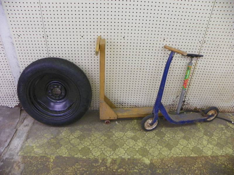 Wheel, two scooters and manual pump