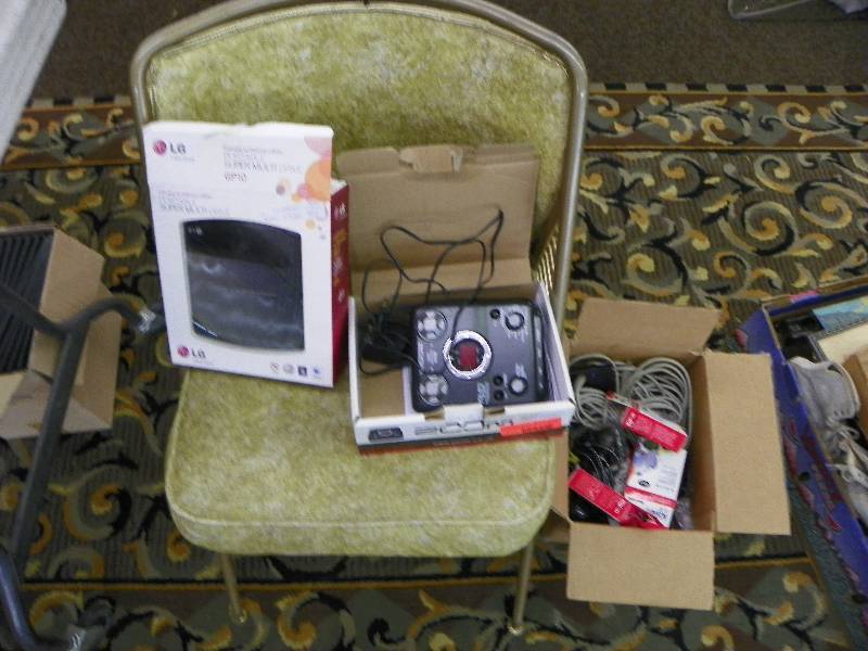 Green Chair, box of cords, Portable drive for Notebook