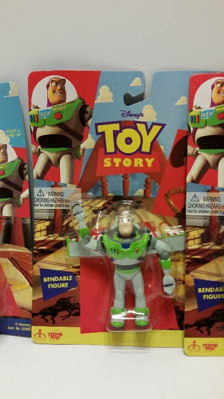 lot 11 image: All Four Toy Story Action Figures in their Original Packaging - Woody, Buzz, Rex and Hamm