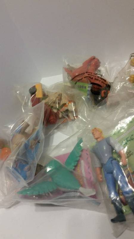 lot 26 image: Lot of (17) Disney Pocohantas, Lion King and Oliver Toys in Original Packaging - See Pictures and Description