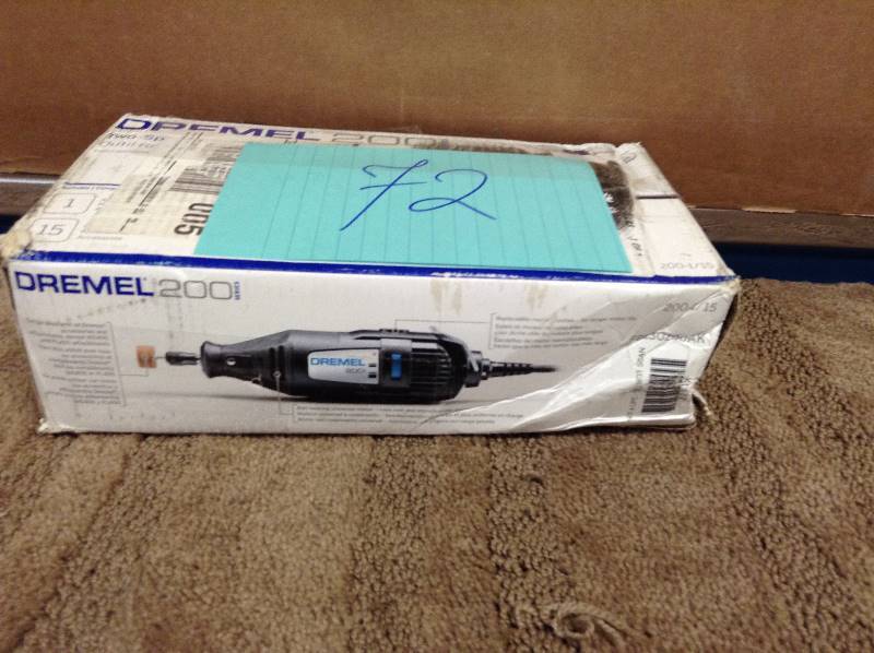 lot 72 image: Dremel 200 Series 1.15 Amp 2-Speed Corded Rotary Tool with some attachments