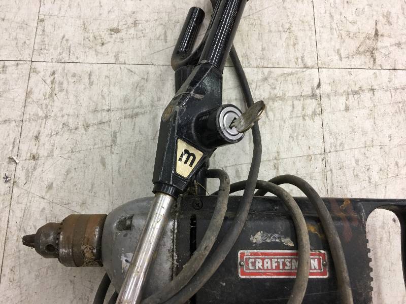 lot 22 image: craftsman drill and steering wheel lock