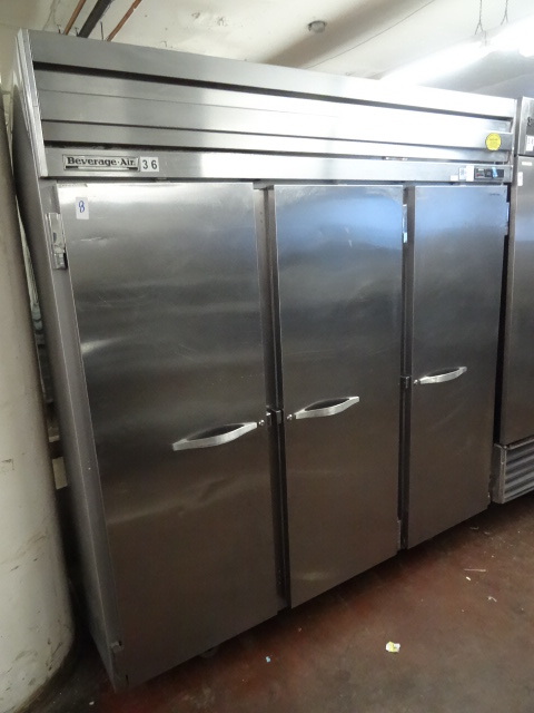 lot 8 image: Beverage air 3 door freezer. On whe...