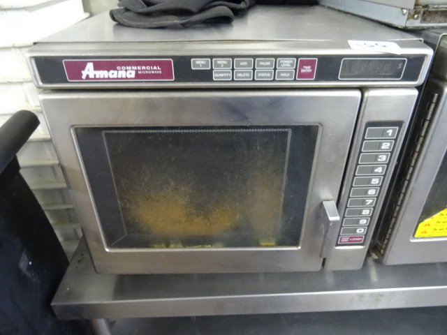 lot 100 image: Amana commercial microwave. Model K...