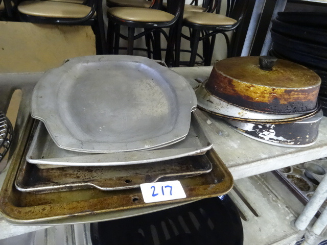 lot 217 image: Misc cooking grates. Pans. Lids...
