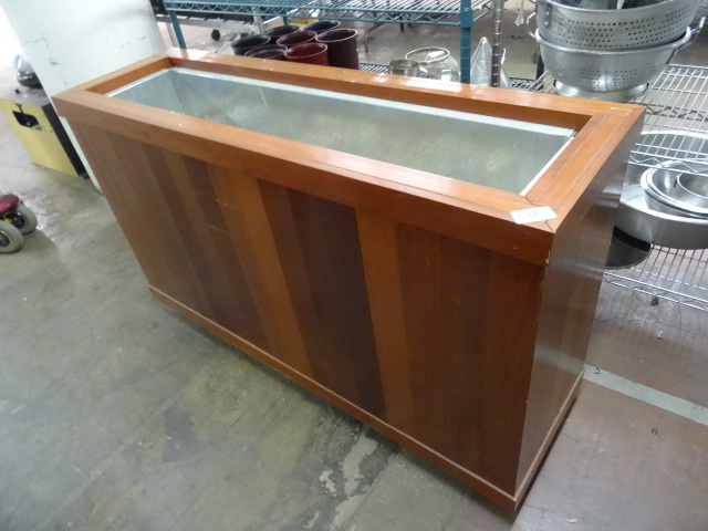 lot 302 image: Plant stand. On wheels. Steel inser...