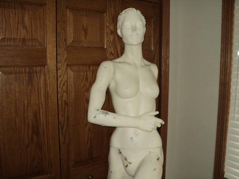 white female mannequin, missing lef...