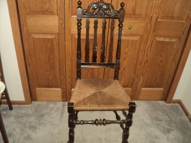 carved wooden chair, woven seat ...