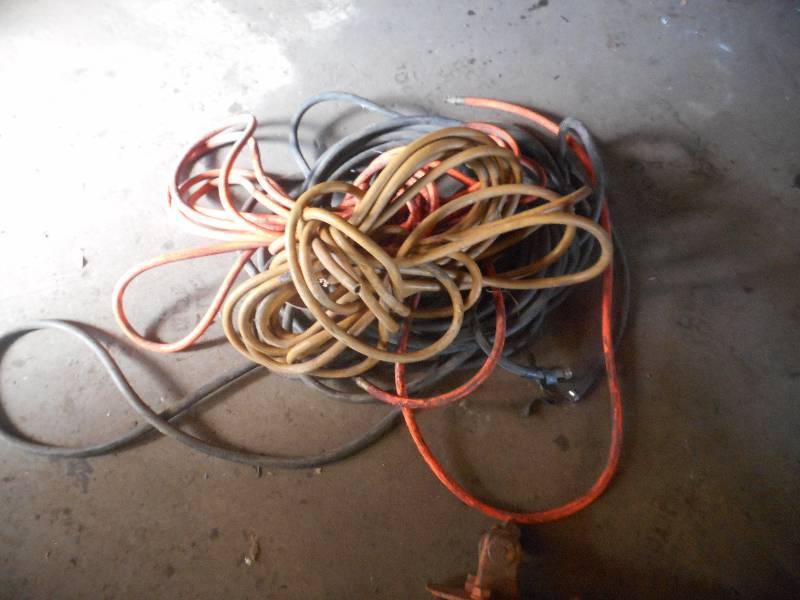 PILE OF AIR HOSES.