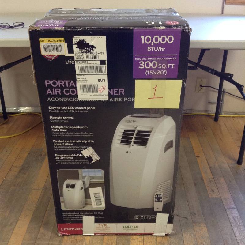 lot 1 image: LG Portable Air Conditioner -LP1015WN not used
