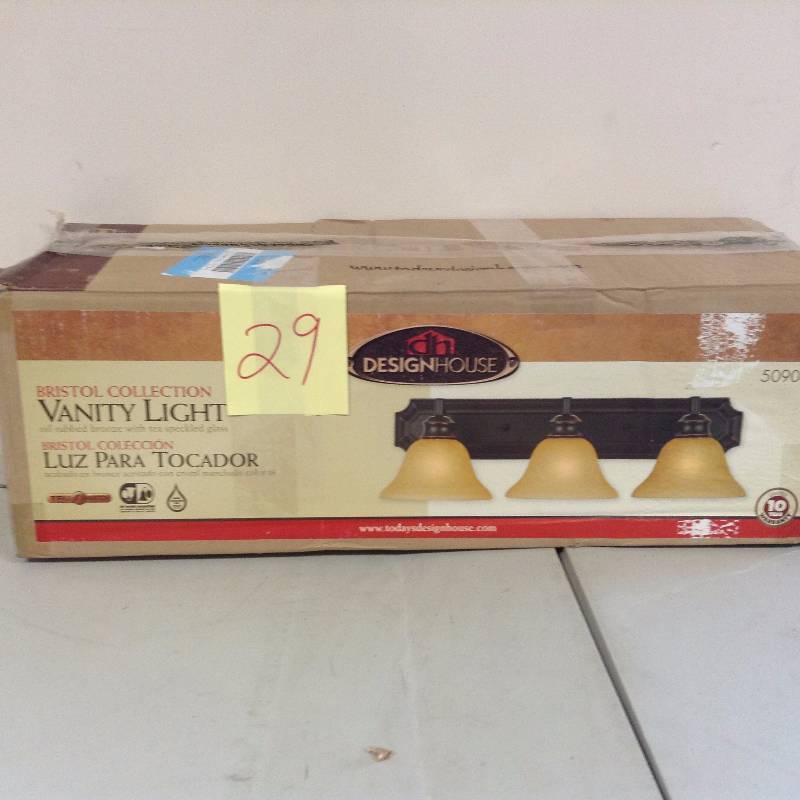 lot 29 image: Bristol Three-Light Vanity Oil-Rubbed Bronze Tea-Speckled Glass never used