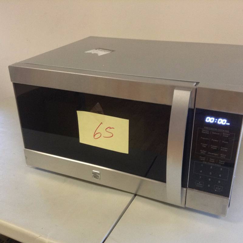 lot 65 image: Kenmore Elite 2 cu ft microwave never used small dent